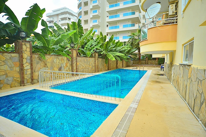 Трехкомнатная квартира в районе Махмутлар