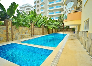 Трехкомнатная квартира в районе Махмутлар