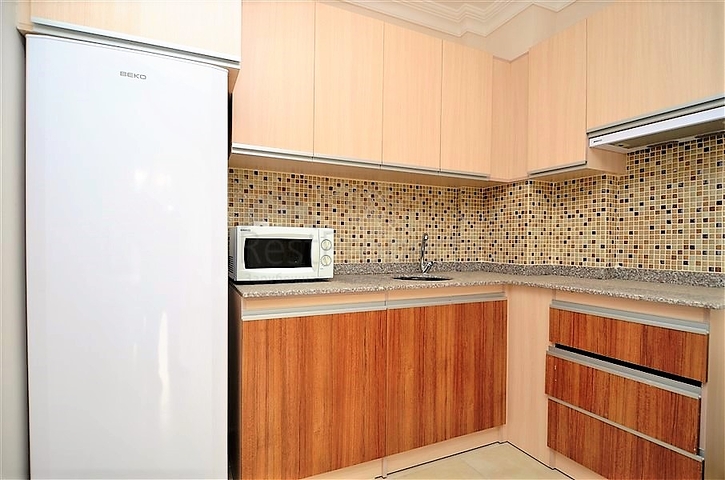 Меблированная квартира 1+1 в районе Махмутлар