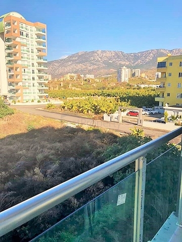 Двухкомнатная квартира в Махмутларе по выгодной цене