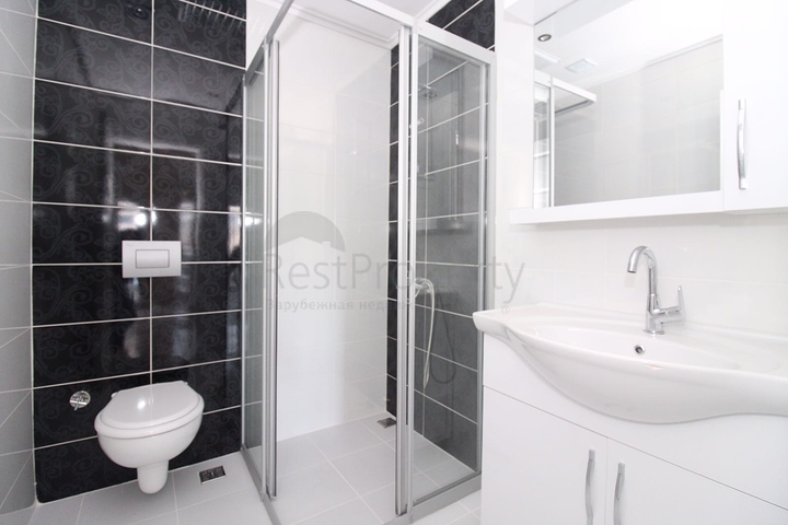 Трехкомнатная квартира в районе Махмутлар