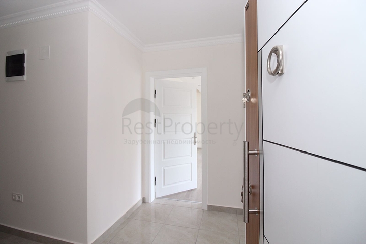 Трехкомнатная квартира в районе Махмутлар