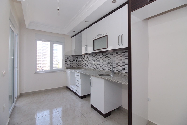 Трехкомнатная квартира в районе Махмутлар