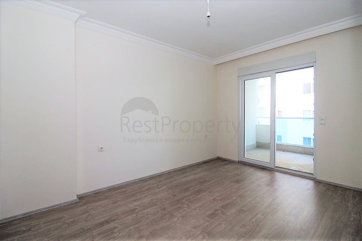 Трехкомнатная квартира в районе Махмутлар