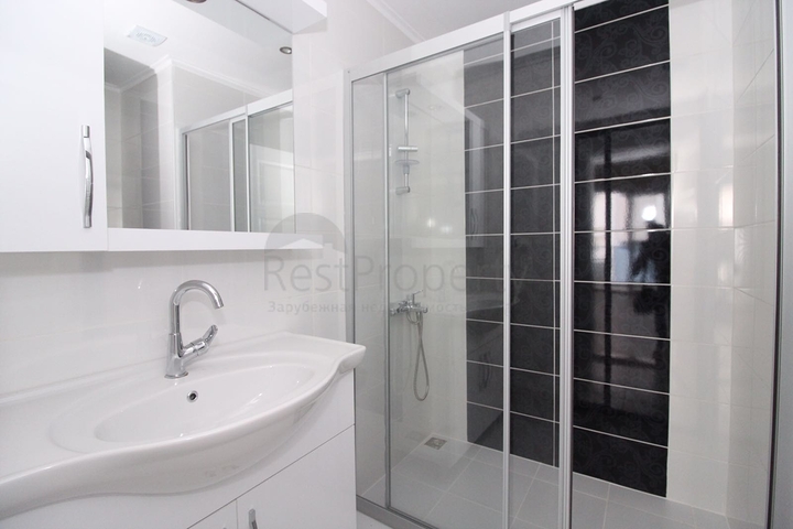 Трехкомнатная квартира в районе Махмутлар