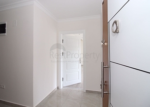 Трехкомнатная квартира в районе Махмутлар