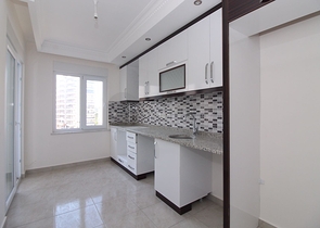 Трехкомнатная квартира в районе Махмутлар