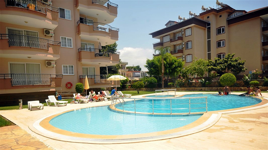 Трехкомнатная квартира с мебелью в жилом комплексе района Оба