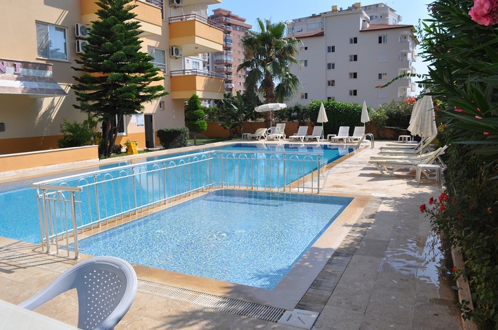 Просторная квартира с двумя спальными комнатами в Махмутларе