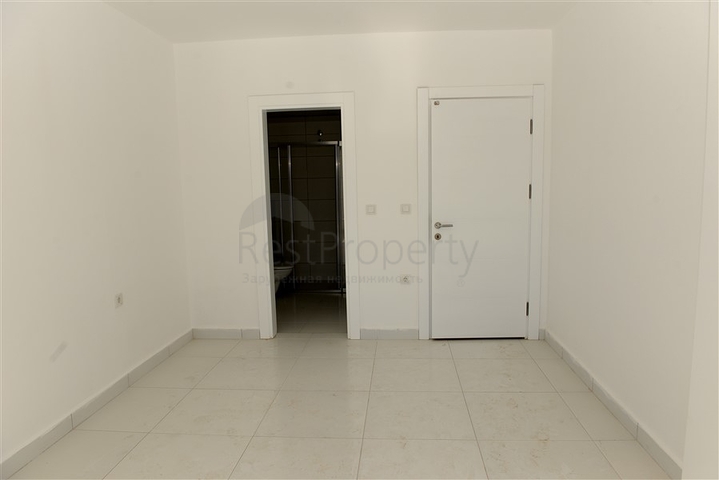 Трехкомнатная квартира с отдельной кухней в Махмутларе