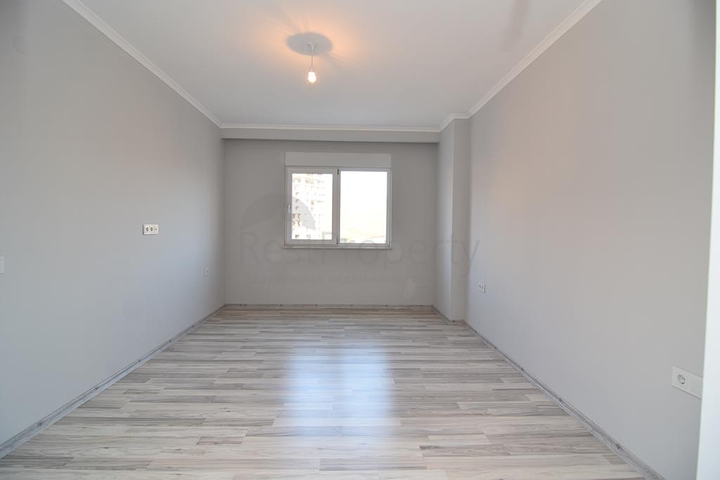 Большая квартира с тремя спальными комнатами в Махмутларе