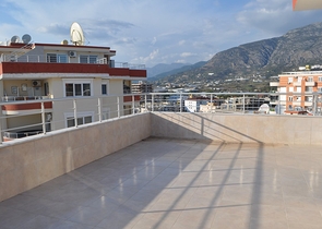 Пентхаус с четырьмя спальными комнатами в Махмутларе