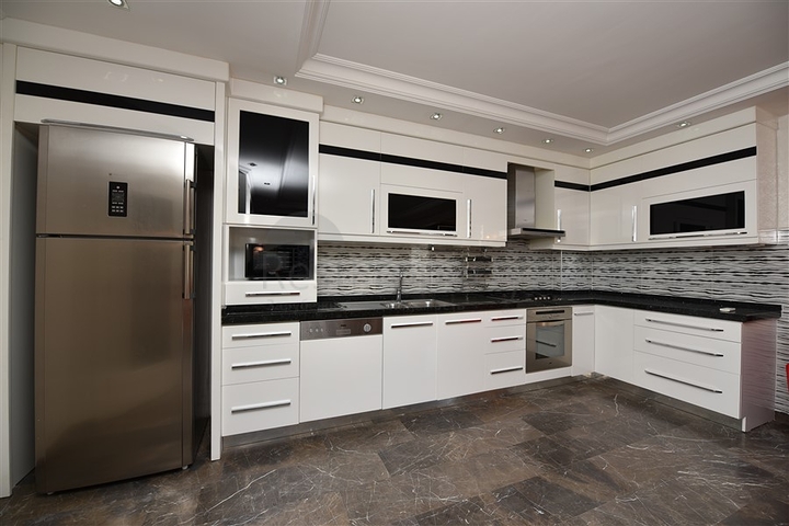 Пентхаус с четырьмя спальнями в районе Махмутлар