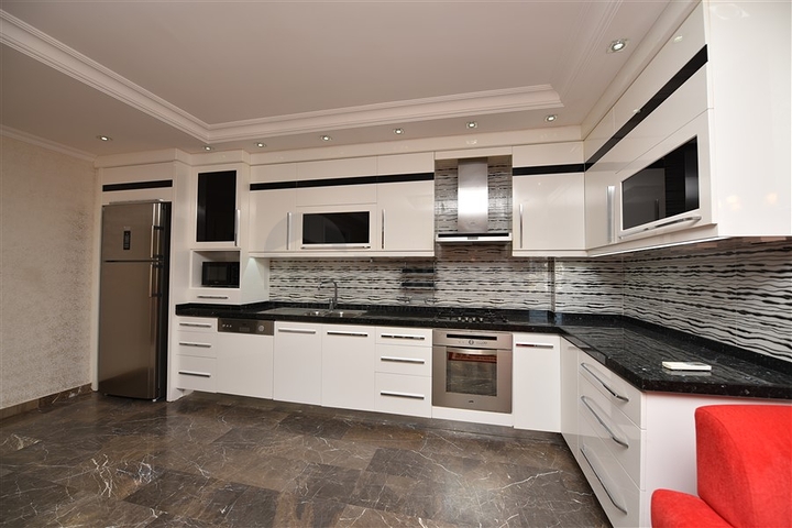 Пентхаус с четырьмя спальнями в районе Махмутлар