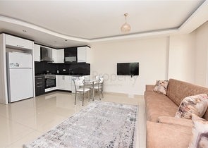  Квартира 1+1 в Махмутларе, рядом с морем