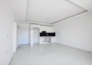 Просторная двухкомнатная квартира в Алании с отличной инфраструктурой