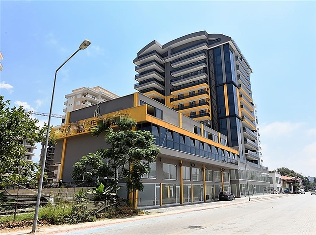 Квартира 2+1 с большой террасой в новом комплексе в Махмутларе