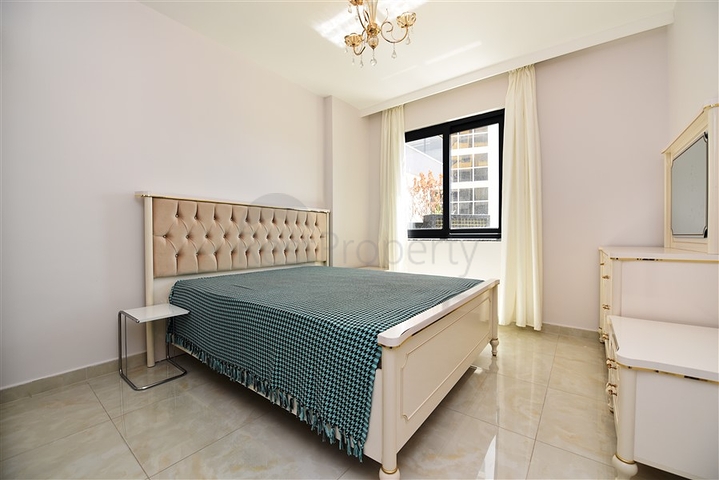 Квартира 2+1 с большой террасой в новом комплексе в Махмутларе