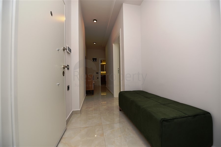 Квартира 2+1 с большой террасой в новом комплексе в Махмутларе