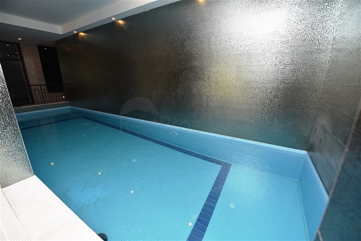 Квартира 2+1 с большой террасой в новом комплексе в Махмутларе