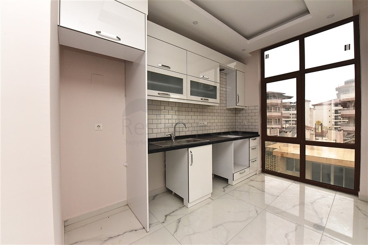 Квартира 2+1 скомплексе на берегу моря, в центре Алании