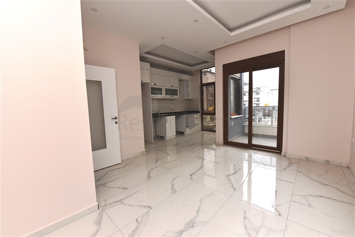 Квартира 2+1 скомплексе на берегу моря, в центре Алании