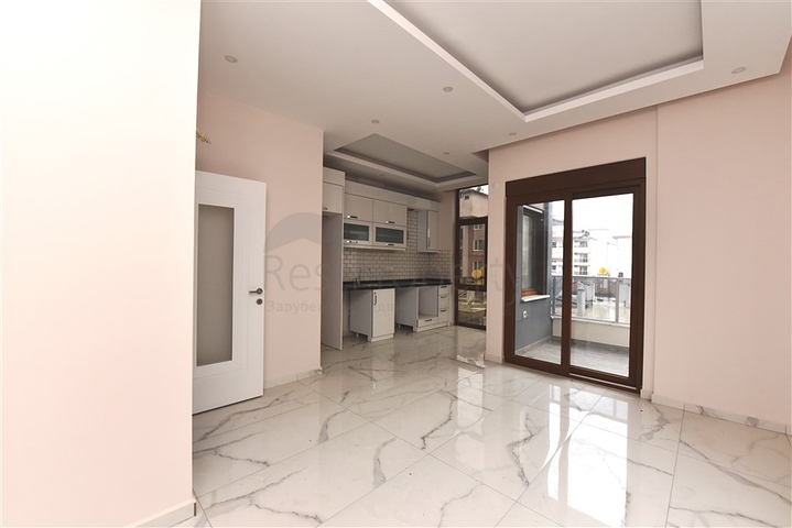 Квартира 2+1 скомплексе на берегу моря, в центре Алании