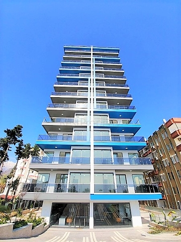 Апартаменты 2+1 на первой береговой линии в Махмутларе