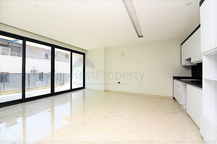 Апартаменты 2+1 на первой береговой линии в Махмутларе