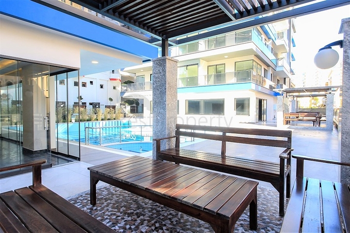 Апартаменты 2+1 на первой береговой линии в Махмутларе