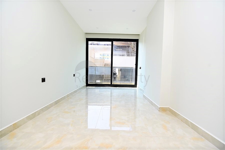 Апартаменты 2+1 на первой береговой линии в Махмутларе