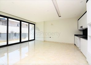 Апартаменты 2+1 на первой береговой линии в Махмутларе