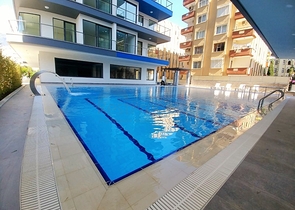 Апартаменты 2+1 на первой береговой линии в Махмутларе