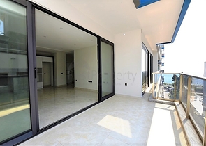 Апартаменты 2+1 на первой береговой линии в Махмутларе