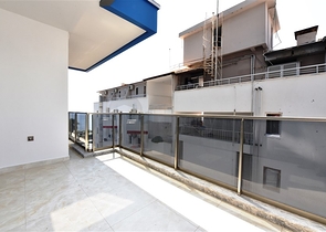 Апартаменты 2+1 на первой береговой линии в Махмутларе