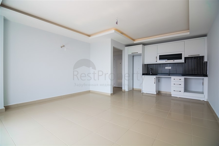 Двухкомнатная квартира в районе Махмутлар