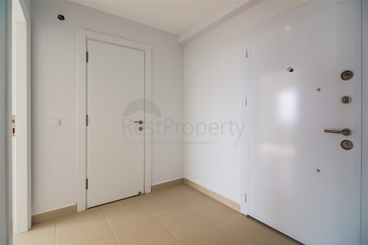 Двухкомнатная квартира в районе Махмутлар