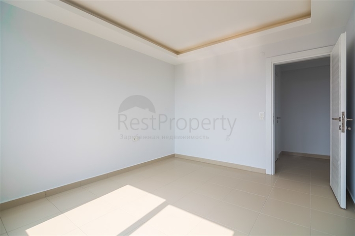 Двухкомнатная квартира в районе Махмутлар