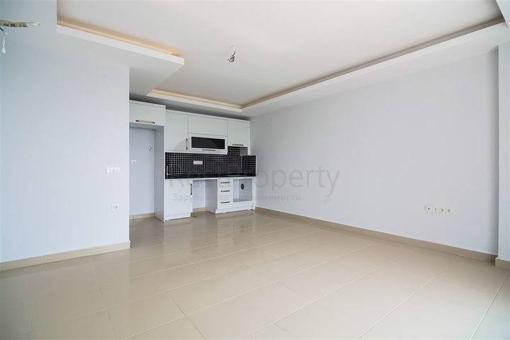 Двухкомнатная квартира в районе Махмутлар