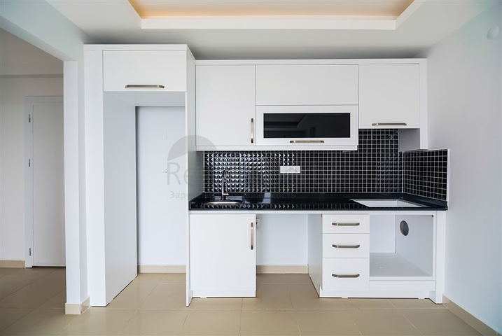 Двухкомнатная квартира в районе Махмутлар