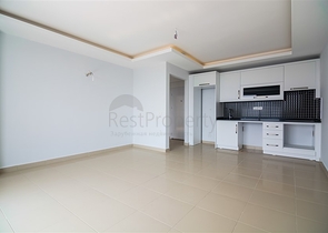 Двухкомнатная квартира в районе Махмутлар