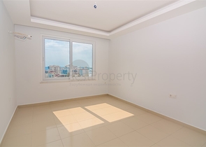 Двухкомнатная квартира в районе Махмутлар