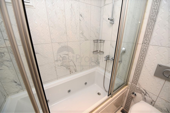 Квартира с тремя спальнями в Махмутларе