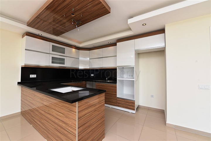 Квартира с тремя спальнями в Махмутларе