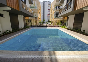 Квартиры 1+1, 2+1, 3+1 в комплексе в районе Гюзельоба Лара 