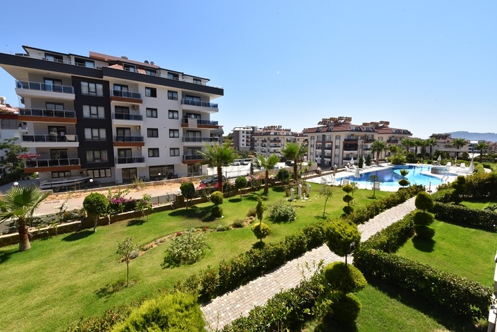 Квартира с выходом в сад в районе Аланьи Оба