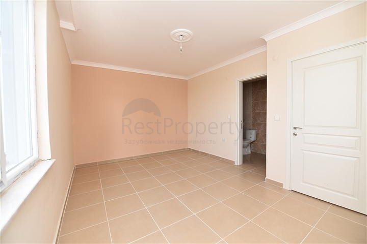 Трехкомнатная квартира в районе Махмутлар