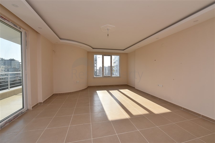 Трехкомнатная квартира в районе Махмутлар