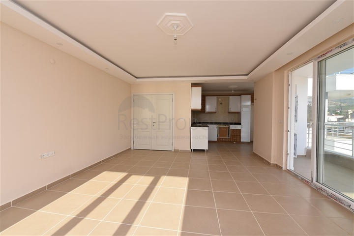 Трехкомнатная квартира в районе Махмутлар