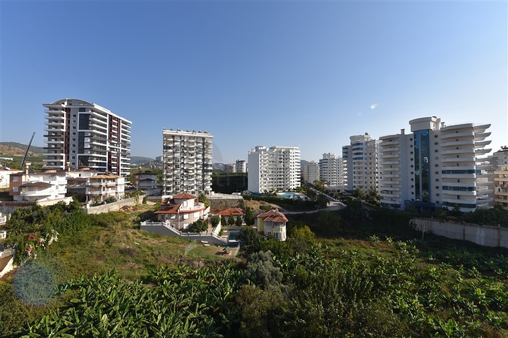 Трехкомнатная квартира в районе Махмутлар